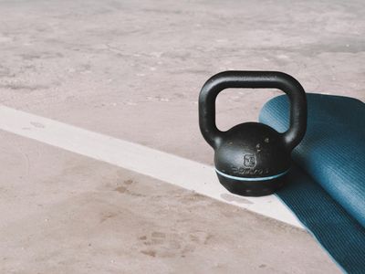 Minimalist fitness gear on dark floor.
